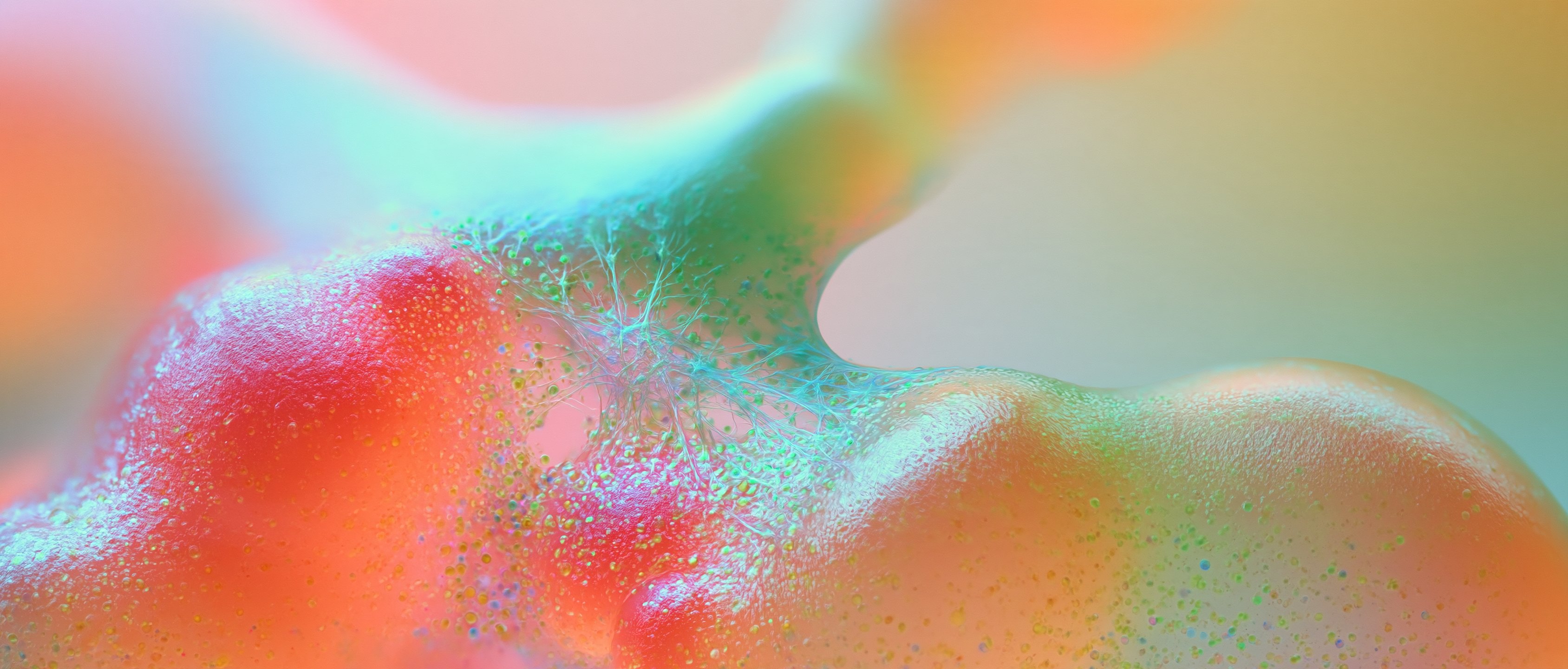 A mint arch of liquid rising over coral forms